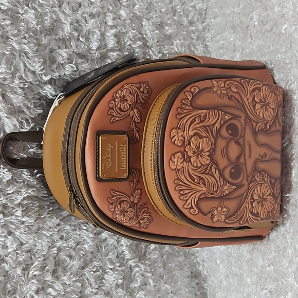 Loungefly Handbags - NWT Loungefly Lilo And Stitch Carving Embossed Design Mini Backpack